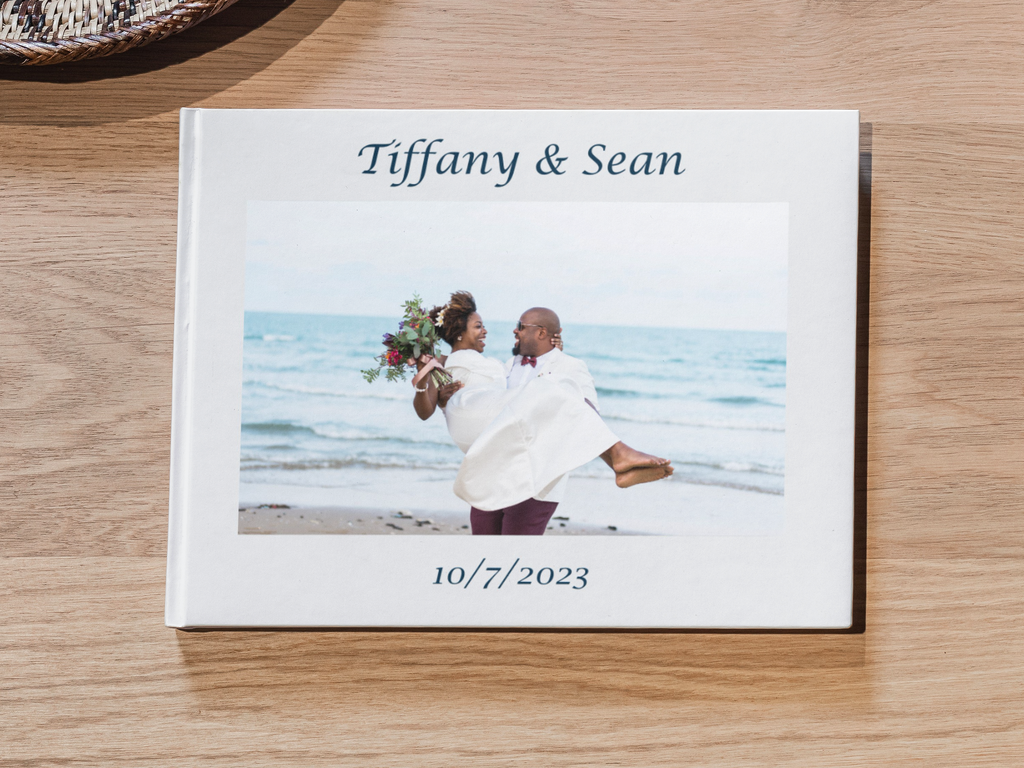 A finished wedding guestbook on a wooden table