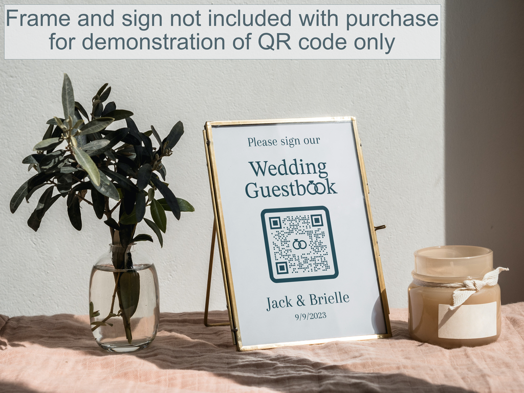 A framed print with a QR code inviting guests to sign a guestbook